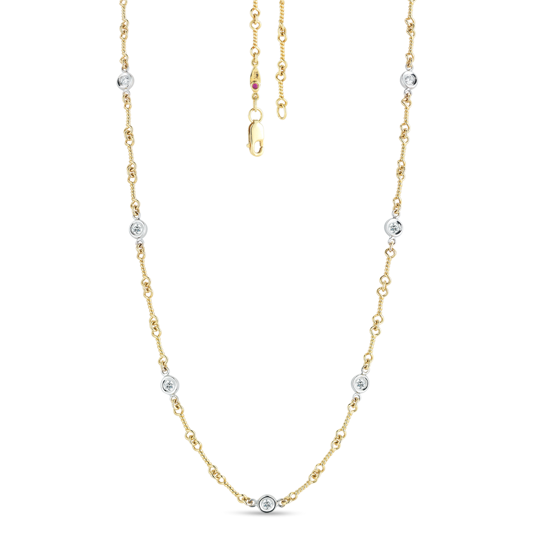 16" 18K YELLOW/WHITE GOLD 7 STATION DIAMOND BY THE YARD NECKLACE CONTAINING 0.28CTS., TOTAL WEIGHT